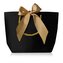 Černá dárková taška se zlatou stuhou M Troli