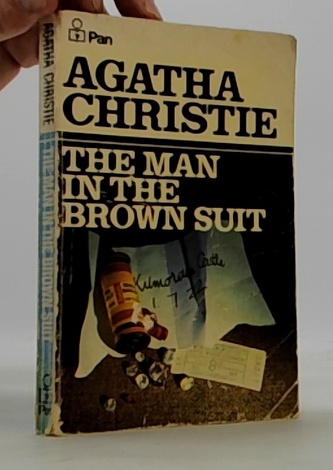 The man in the brown suit